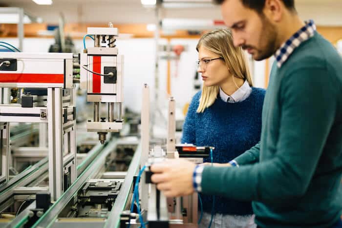 Engineers looking at machines
