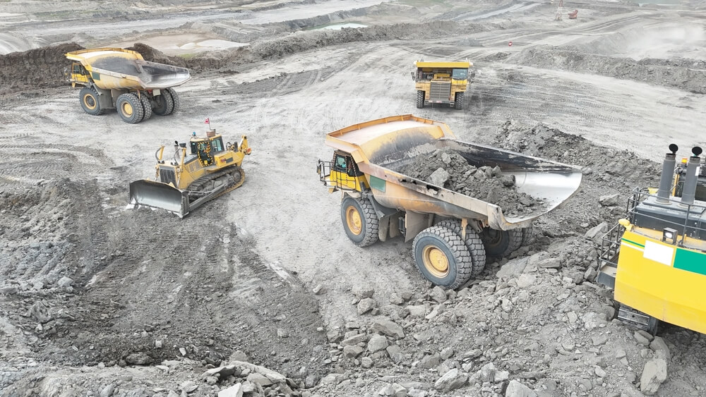 Mineral mine with trucks digging for resources.