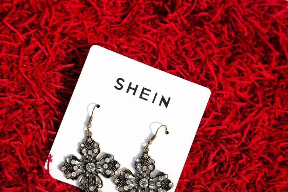 Shein jewelry with red background.