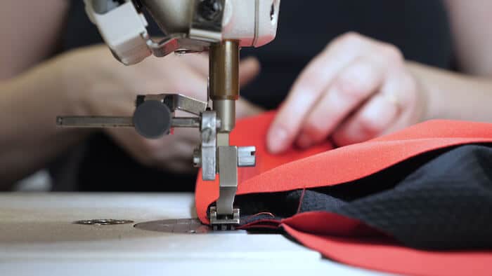 Tailor using a sewing machine