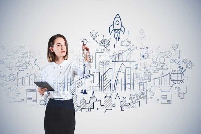 Woman sketching on a board
